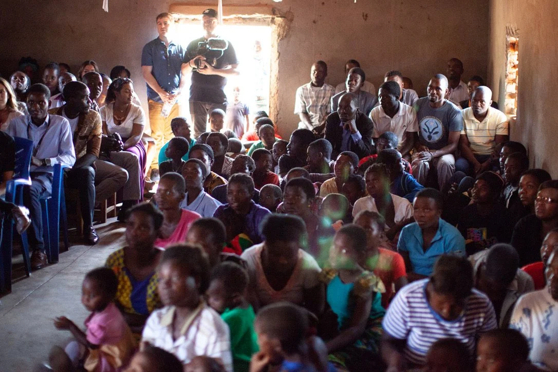 Students gathered inside a bare classroom in Chilinza Village